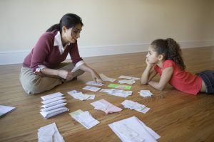 Mother-talking-with-child-about-finances-.jpg