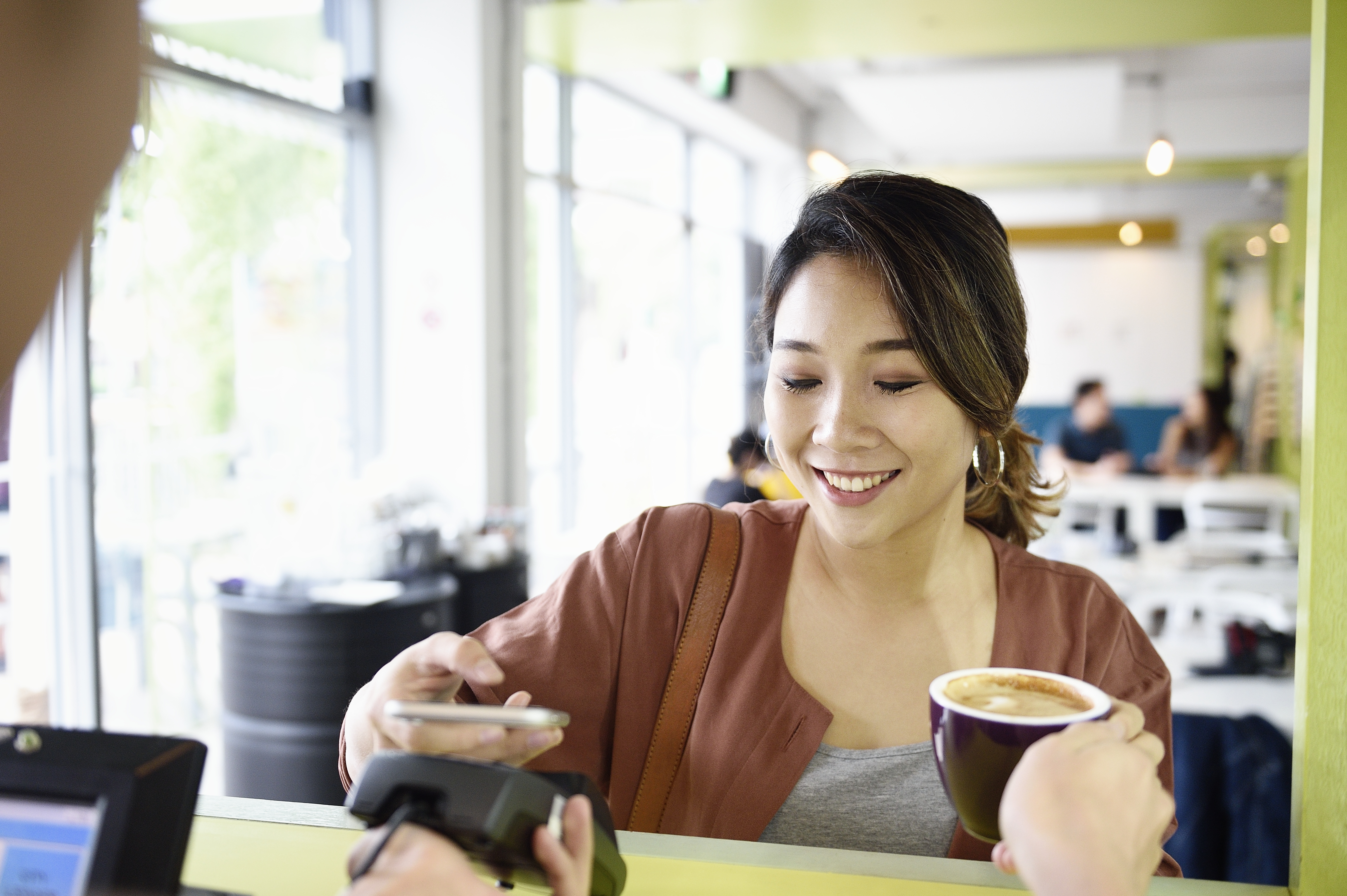 Woman-using-mobile-pay.jpg