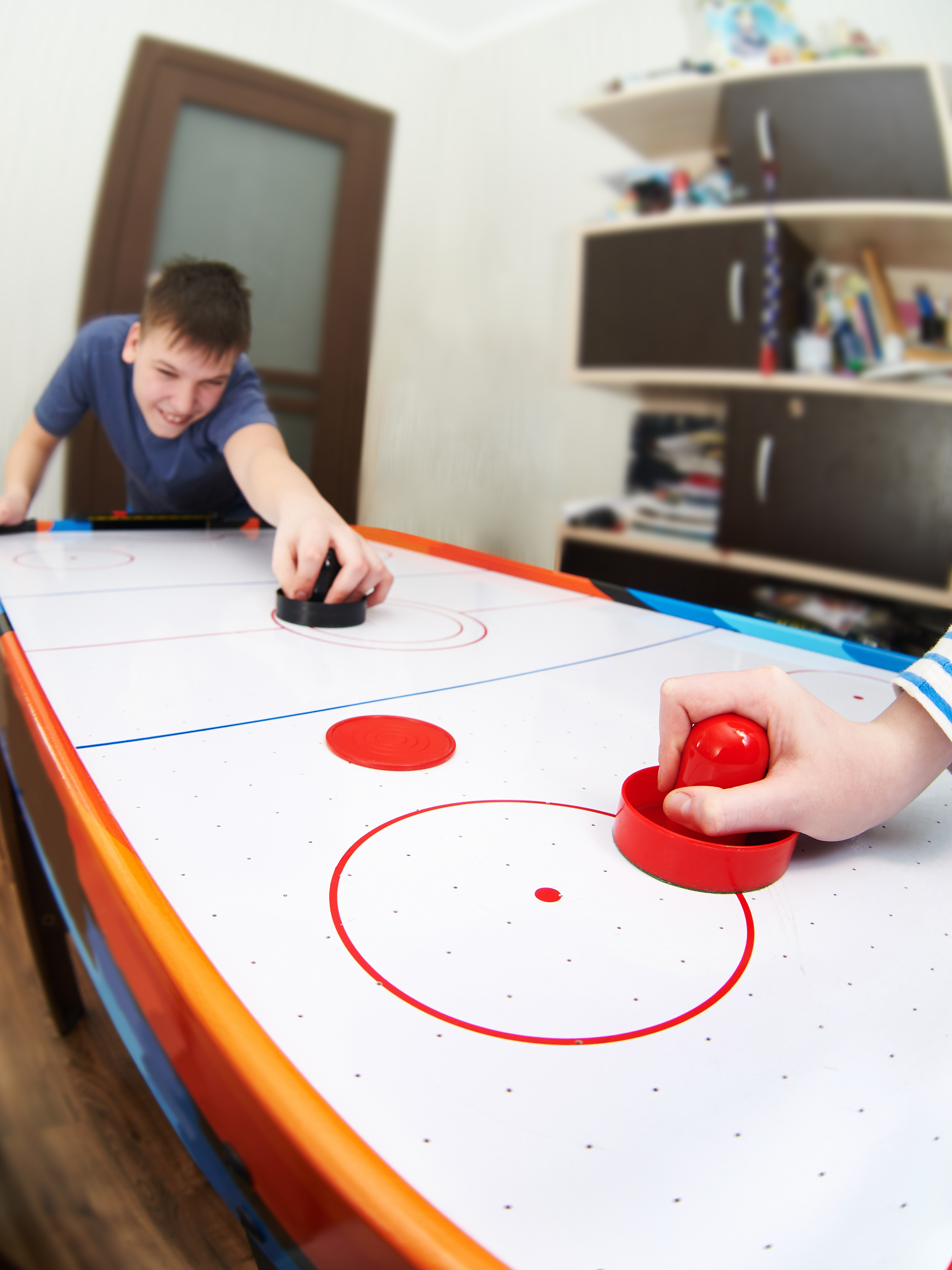 /boys-playing-air-hockey.jpeg