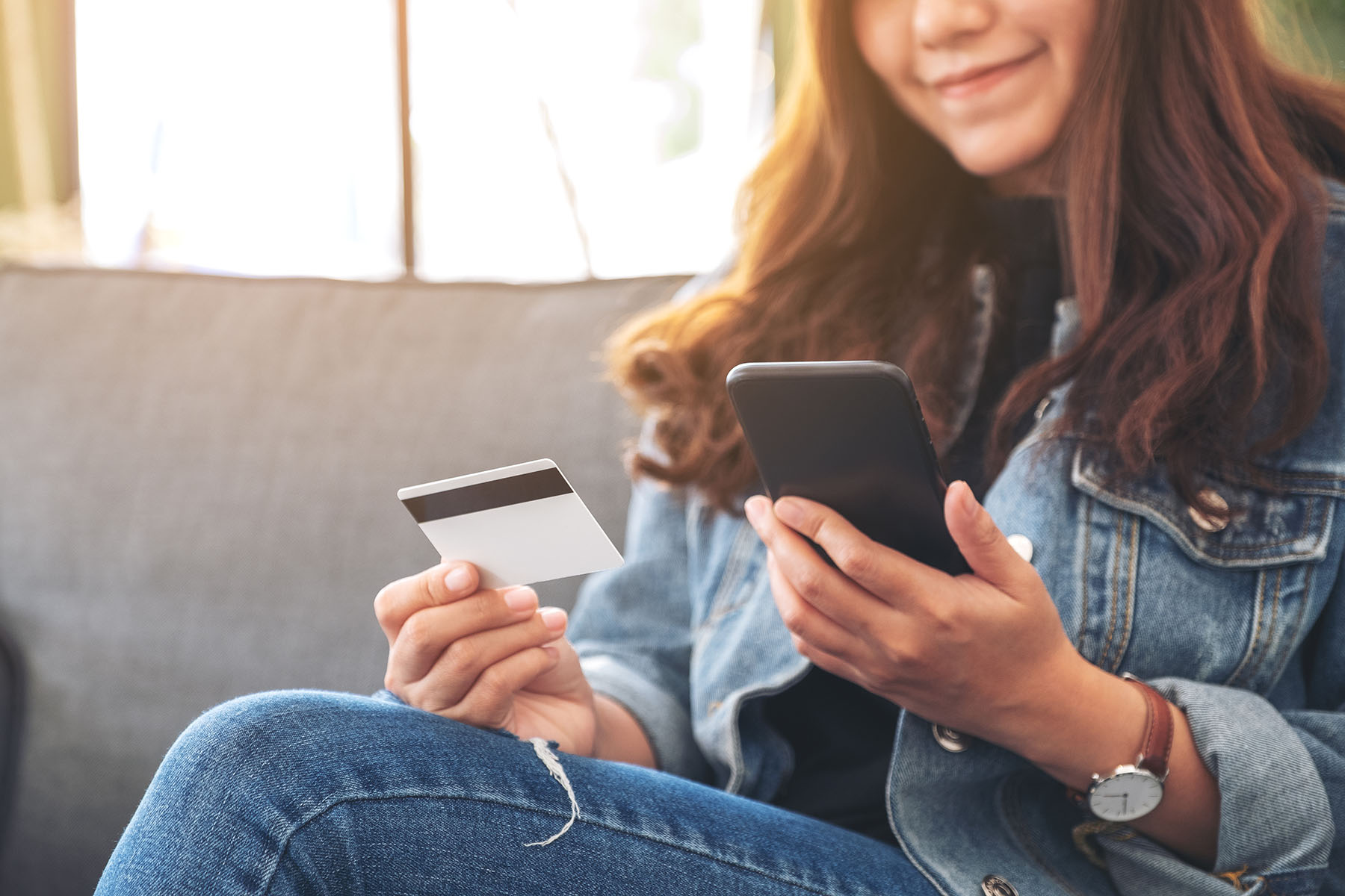 lady-on-phone-with-card-in-her-hand.jpg