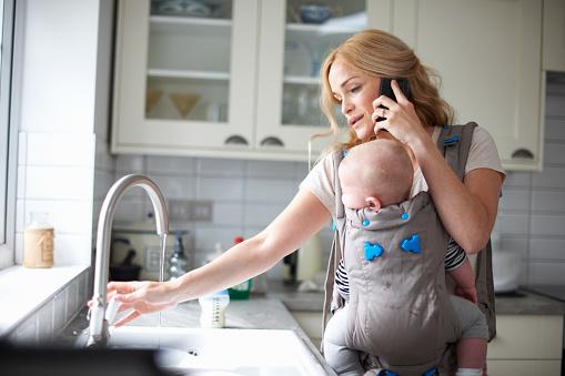 mother-holding-baby-on-the-phone.jpg